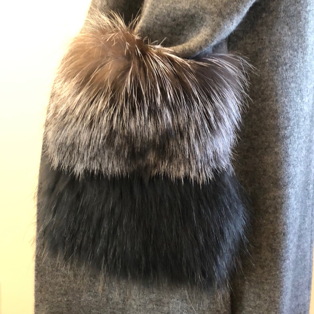 Gray jacket with genuine black fox fur pockets.